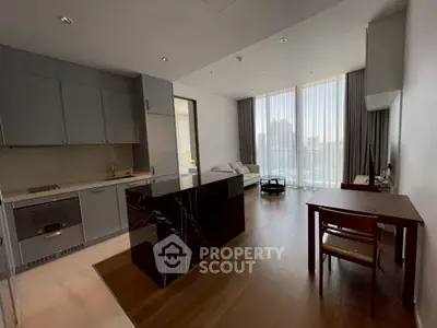 Modern open-layout kitchen and living area with city view