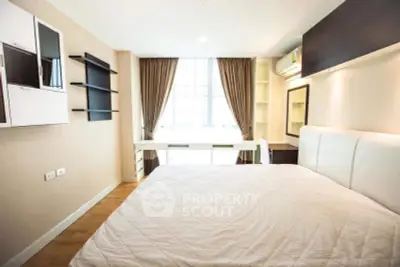 Bright and modern bedroom with stylish decor and ample natural light