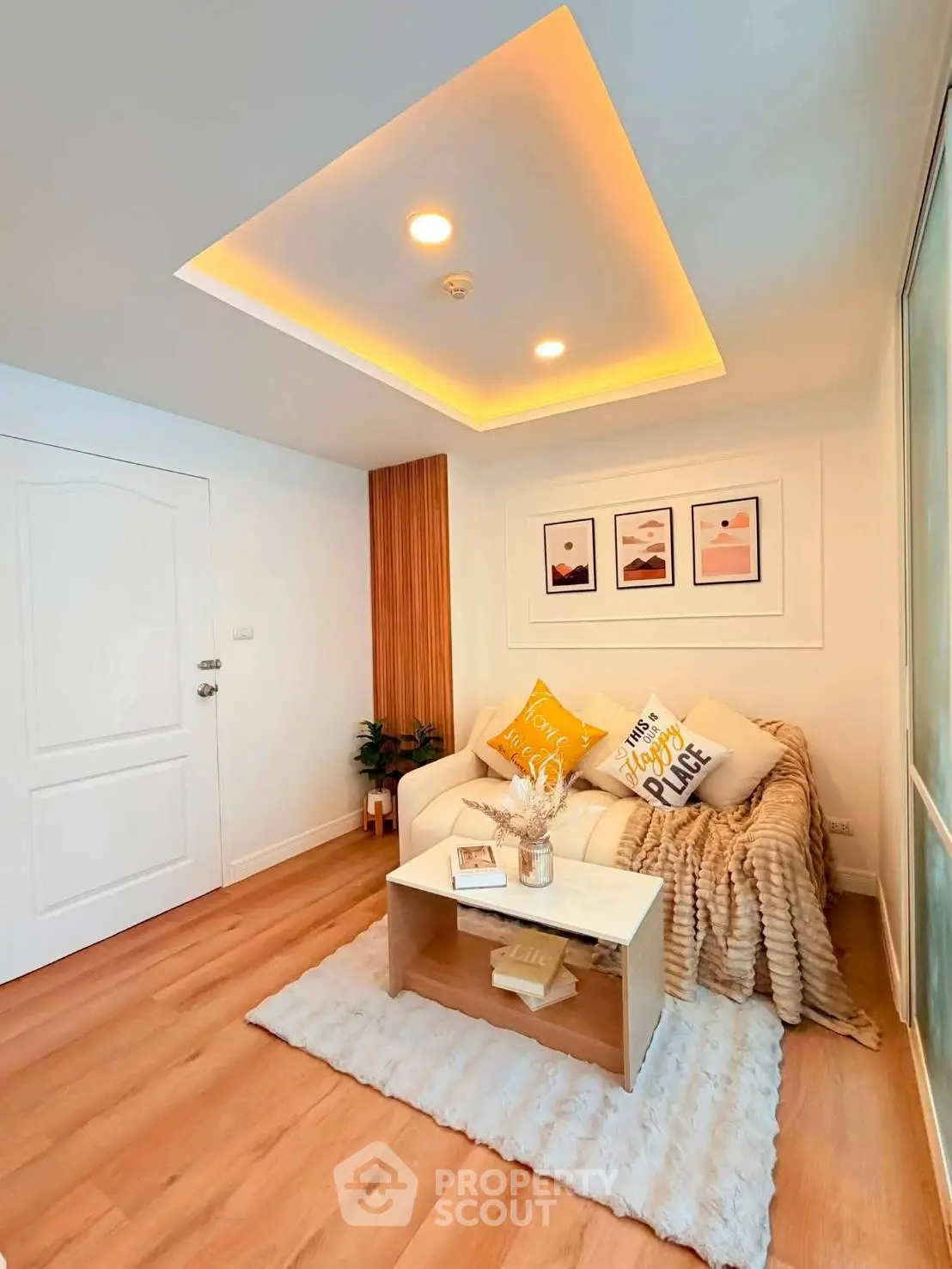 Cozy living room with modern decor and warm lighting, perfect for relaxation.