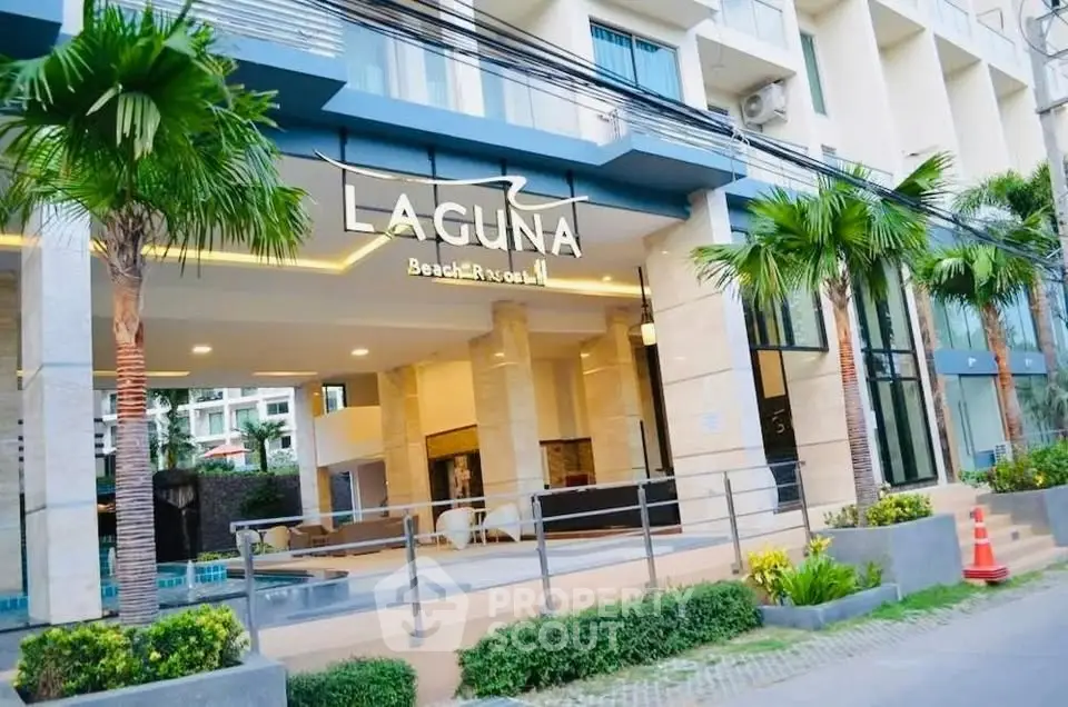 Stunning entrance of Laguna Beach Resort with modern design and lush greenery.