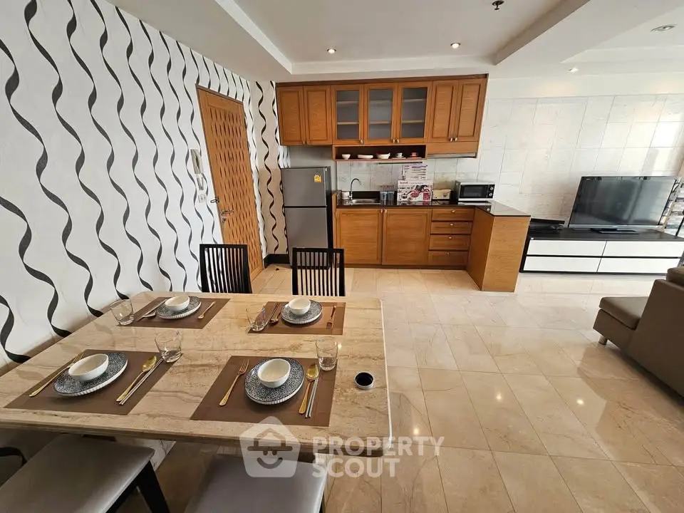 Spacious open-layout kitchen and dining area with modern appliances and stylish decor.
