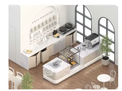 Modern cafe interior with sleek design and stylish furniture, featuring a display of pastries and coffee equipment.
