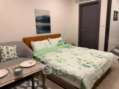 Cozy bedroom with modern decor and dining setup, ideal for urban living