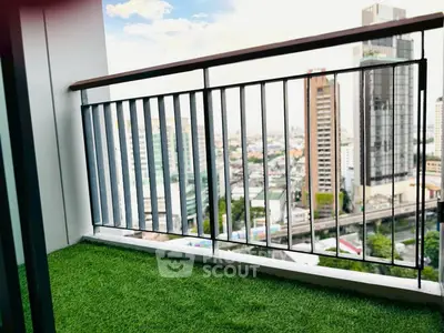 Spacious balcony with artificial grass and stunning city view