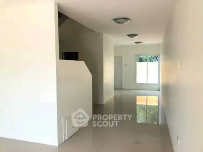 Spacious minimalist interior with glossy floors and modern lighting, perfect for customization.