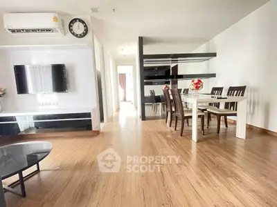 Spacious modern living room with dining area and wooden flooring