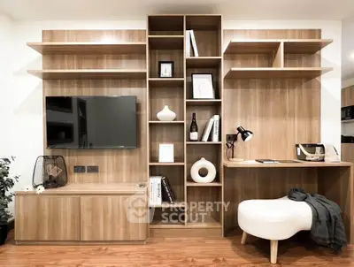Modern living room with stylish wooden shelving and sleek TV setup