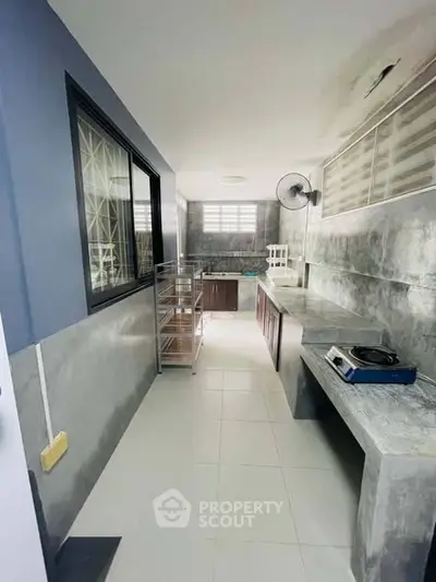 Modern kitchen with sleek countertops and ample natural light