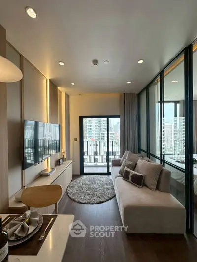 Modern living room with large windows and city view, featuring sleek furniture and stylish decor.