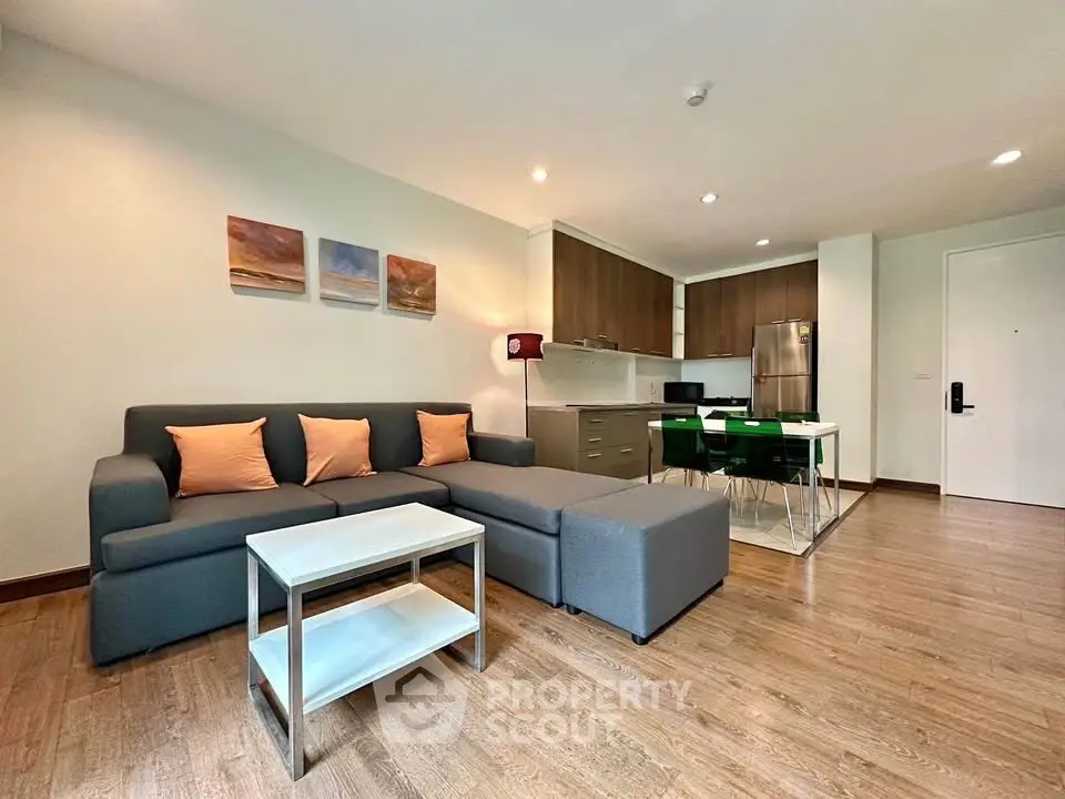 Modern open-plan living room with stylish kitchen and cozy seating area