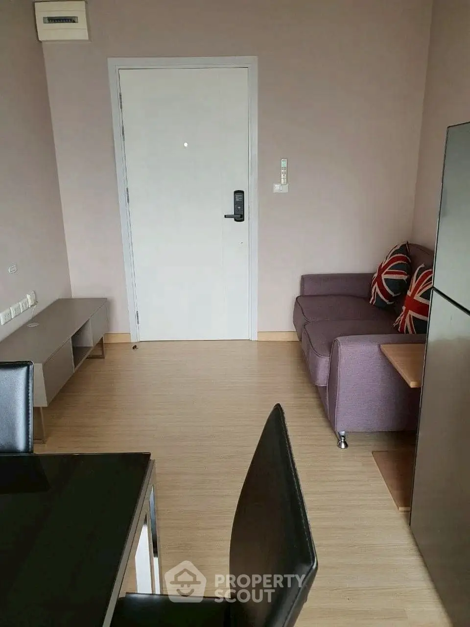 Modern apartment interior with stylish furniture and sleek design, featuring a cozy living area and dining space.