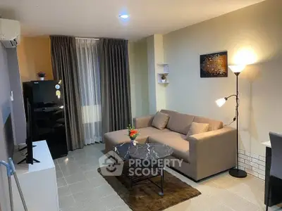 Modern living room with cozy sofa and stylish decor in a contemporary apartment.