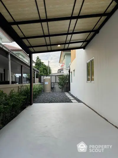 Modern covered patio with sleek design and garden view