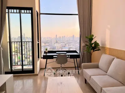 Modern living room with stunning city view, featuring a cozy sofa and stylish workspace by the window.