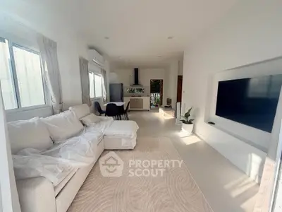 Spacious modern living room with elegant decor and natural light