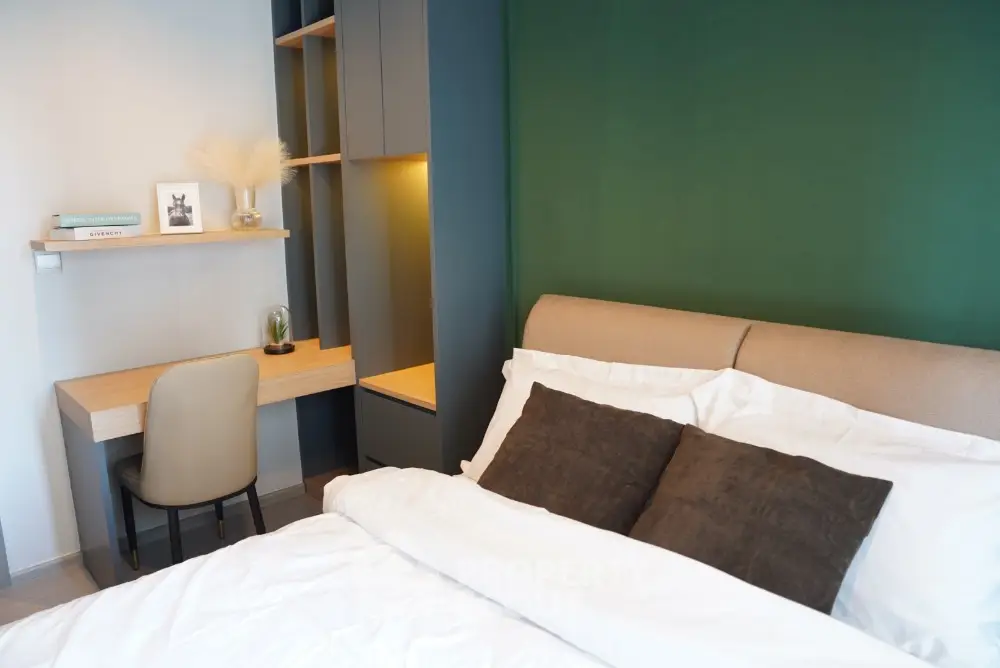 Modern bedroom with stylish decor and cozy workspace
