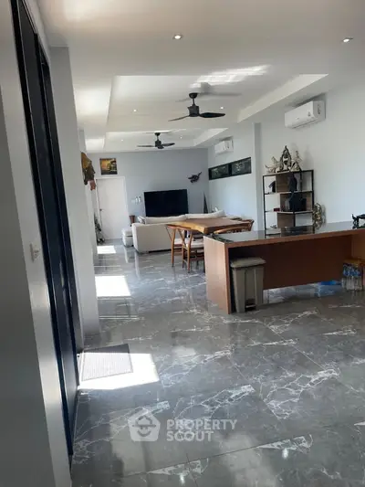 Spacious modern living room with marble flooring and stylish decor