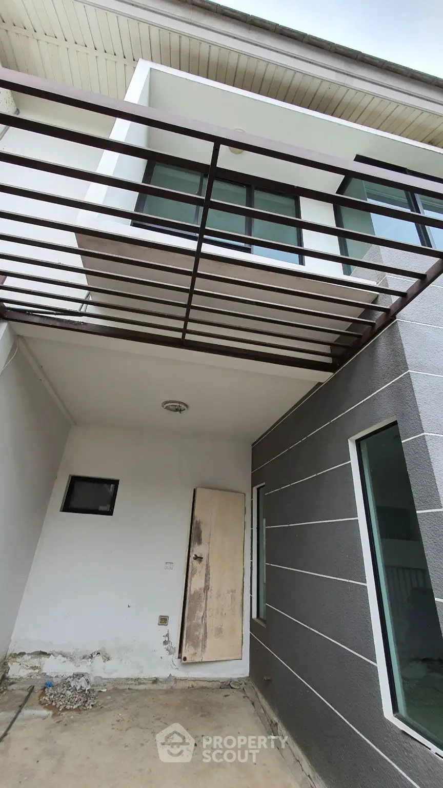 Modern exterior view of a contemporary home with sleek lines and large windows.