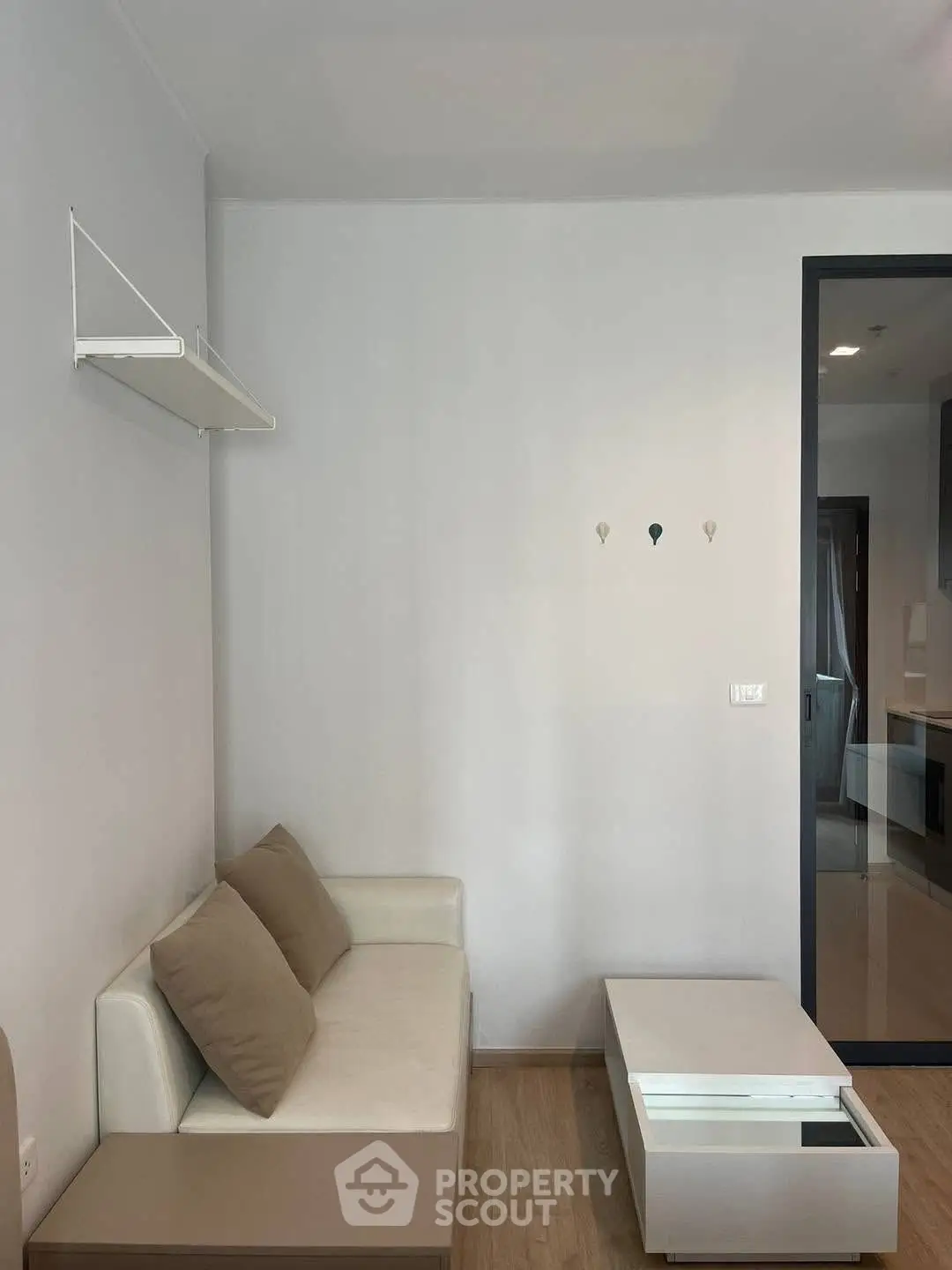 Modern minimalist living room with white sofa and sleek coffee table