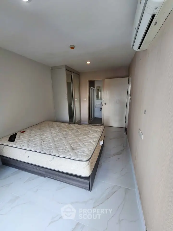 Spacious bedroom with modern design and ample natural light