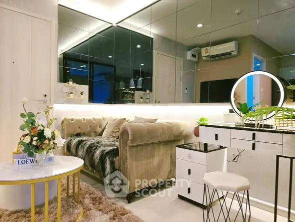 Luxurious living room with plush sofa, mirrored wall, and elegant decor