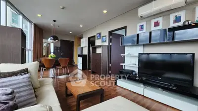 Spacious modern living room with elegant decor and open dining area