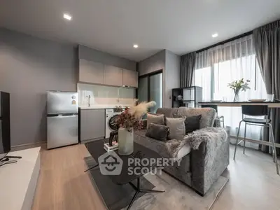 Modern living room with cozy decor and open kitchen layout