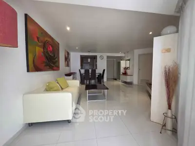 Spacious modern living room with elegant decor and open layout, perfect for entertaining.