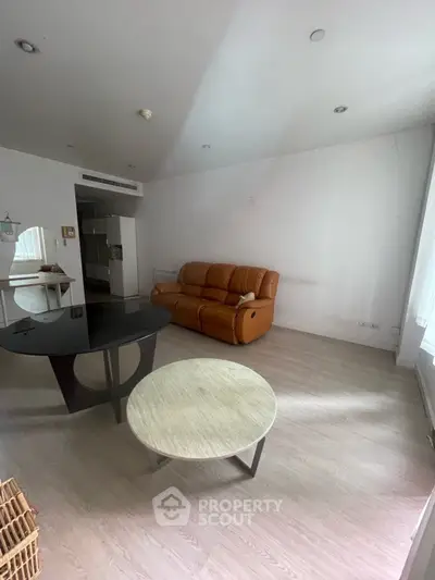 Spacious living room with modern furniture and natural light