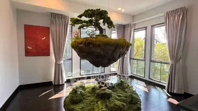 Stunning modern living room with floating bonsai and large windows