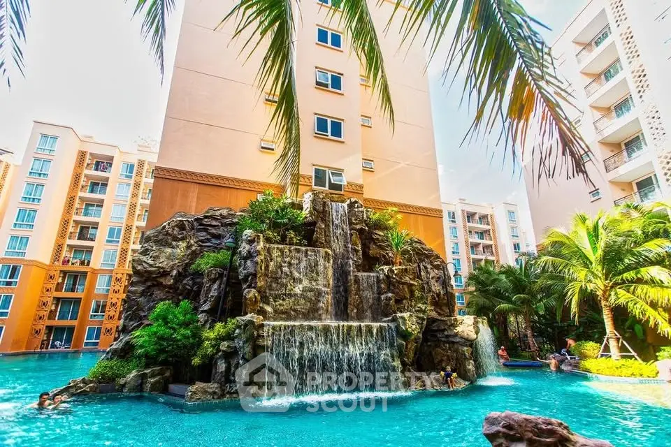 Luxurious apartment complex with stunning pool and waterfall feature