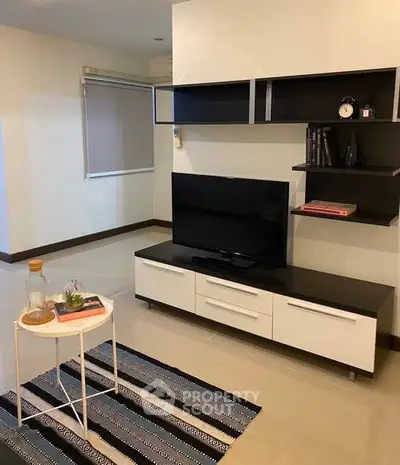 Modern living room with sleek TV unit and stylish decor