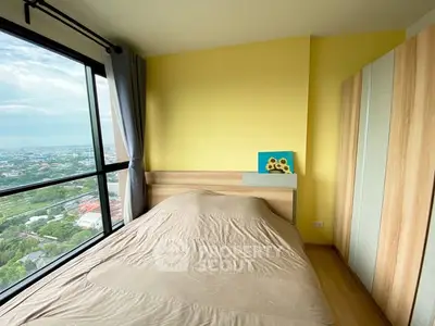 Cozy bedroom with panoramic city view and modern wooden wardrobe.