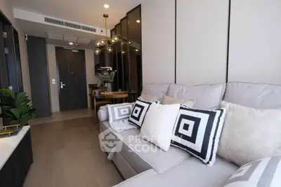 Modern living room with stylish decor and comfortable seating in a contemporary apartment.