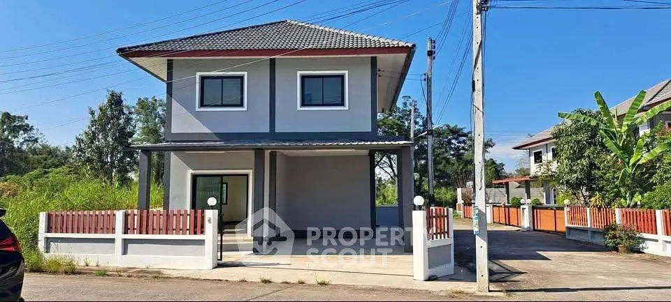 Charming two-story house with modern design and spacious driveway in a serene neighborhood.