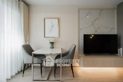 Modern living room with elegant dining area and stylish decor