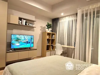 Modern bedroom with stylish decor and cozy ambiance, featuring a TV and study area.