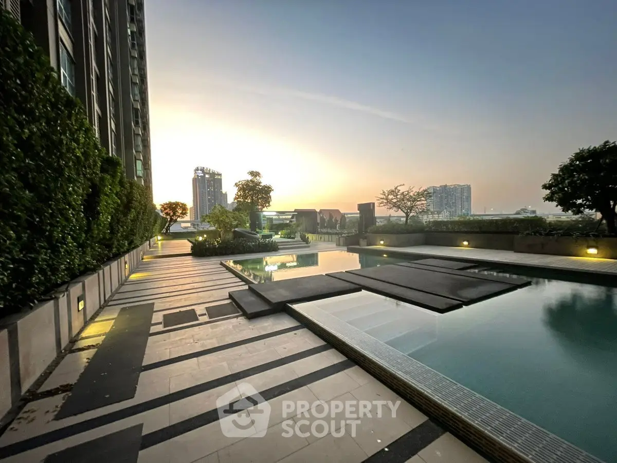 Luxurious rooftop pool with stunning city view at sunset