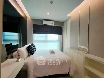 Modern bedroom with sleek design and ample natural light