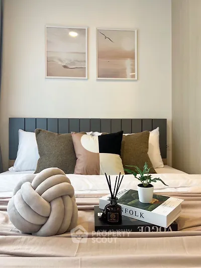 Stylish bedroom with modern decor and cozy bedding, perfect for relaxation.
