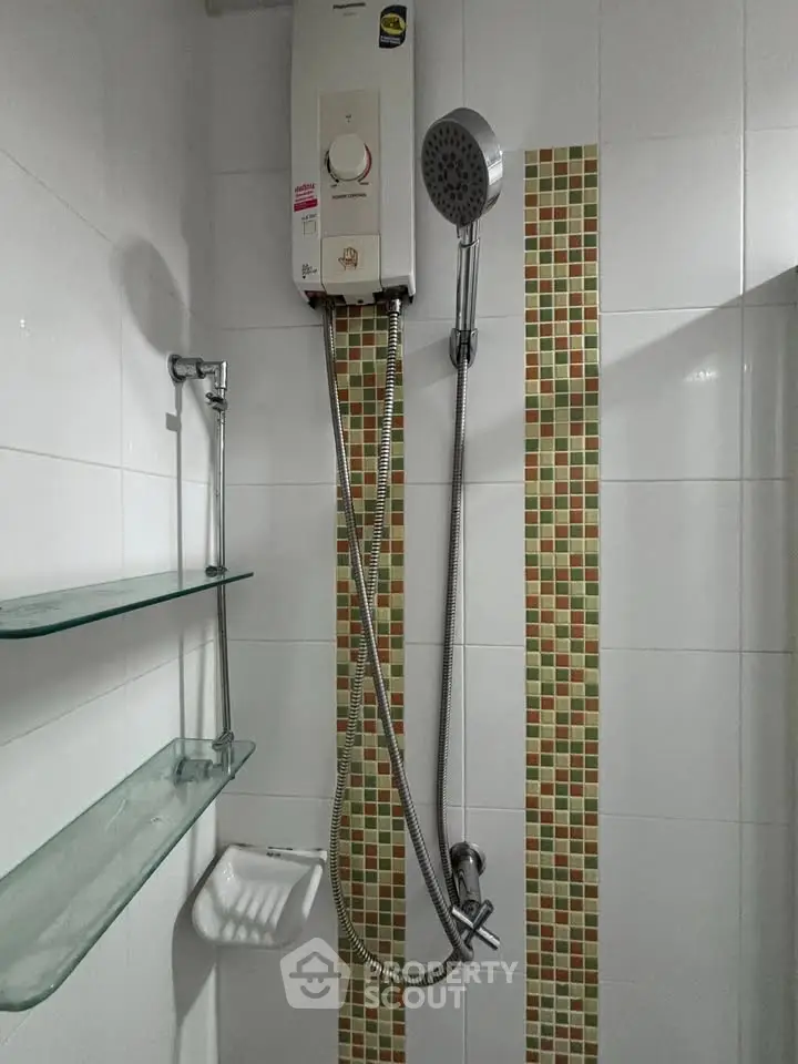 Modern bathroom shower with water heater and stylish tile accents