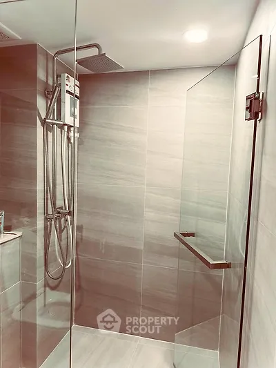 Modern bathroom with sleek glass shower and contemporary fixtures