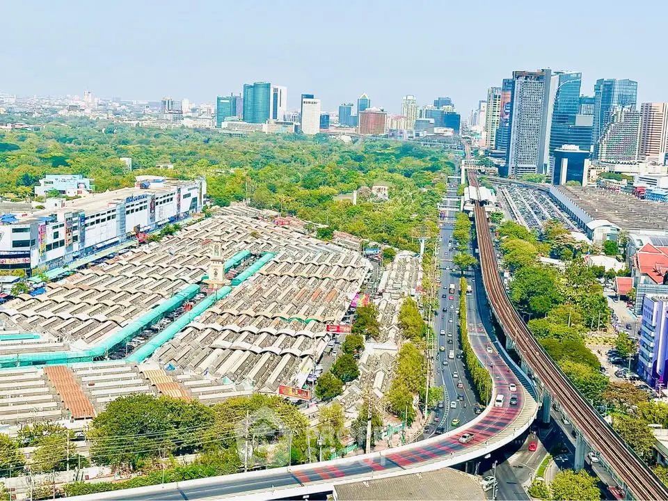 Stunning cityscape view with lush greenery and modern skyscrapers, showcasing urban living at its finest.