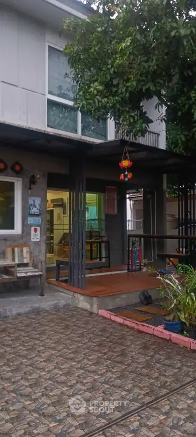 Charming modern home with inviting entrance and lush greenery