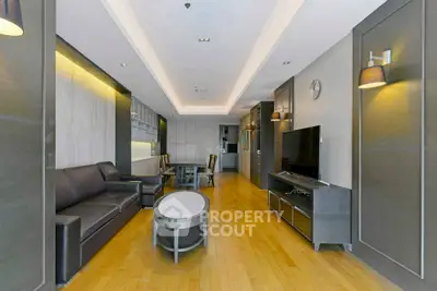 Spacious modern living room with sleek furniture and wooden flooring