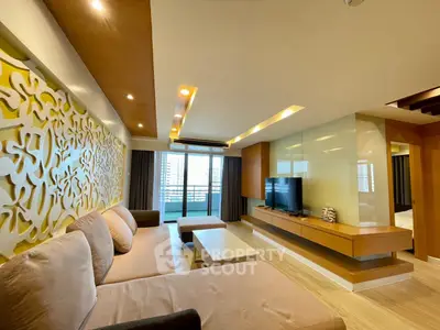 Spacious modern living room with stylish decor and large windows offering a stunning city view.