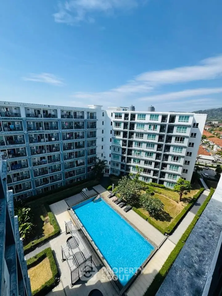 Modern apartment complex with pool and garden view