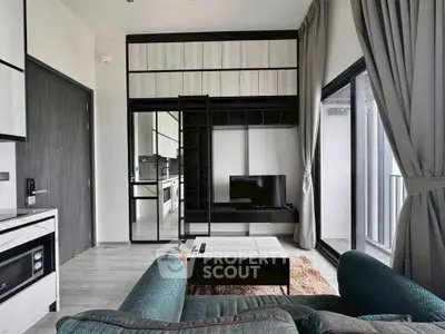 Modern living room with sleek furniture and balcony view