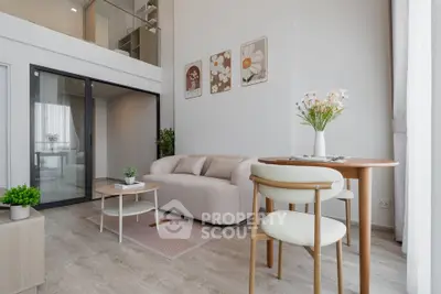 Modern living room with high ceiling and stylish decor in a bright apartment