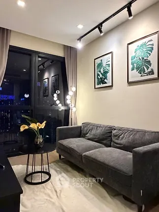 Stylish modern living room with cozy gray sofa and elegant decor
